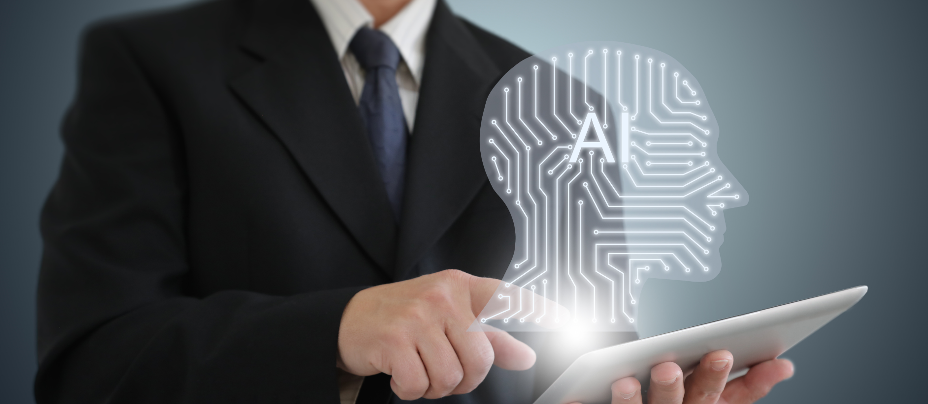 Person in suit holding a tablet with a popup of a head with the text AI inside