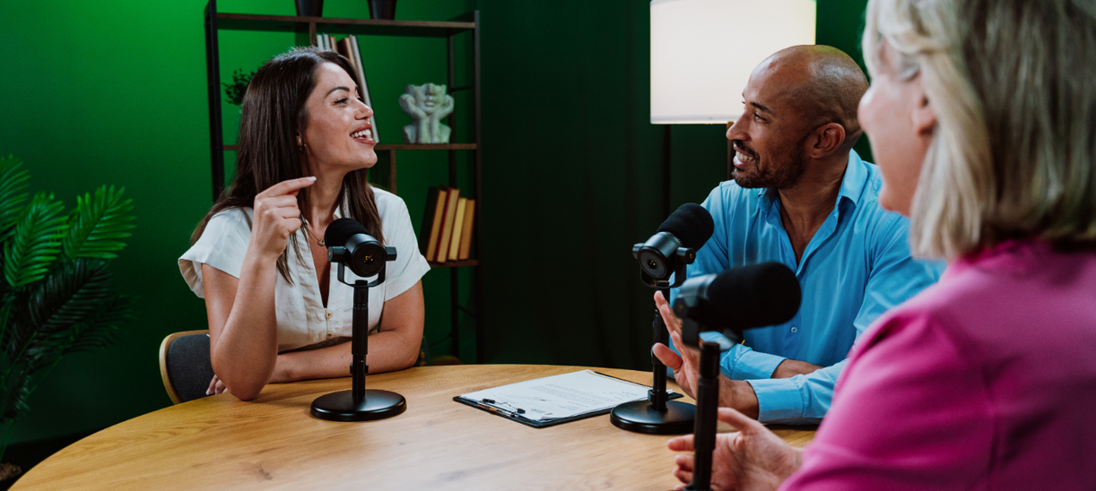 Business professionals recording a podcast interview discussing public relations strategy, executive branding, and media visibility for business growth
