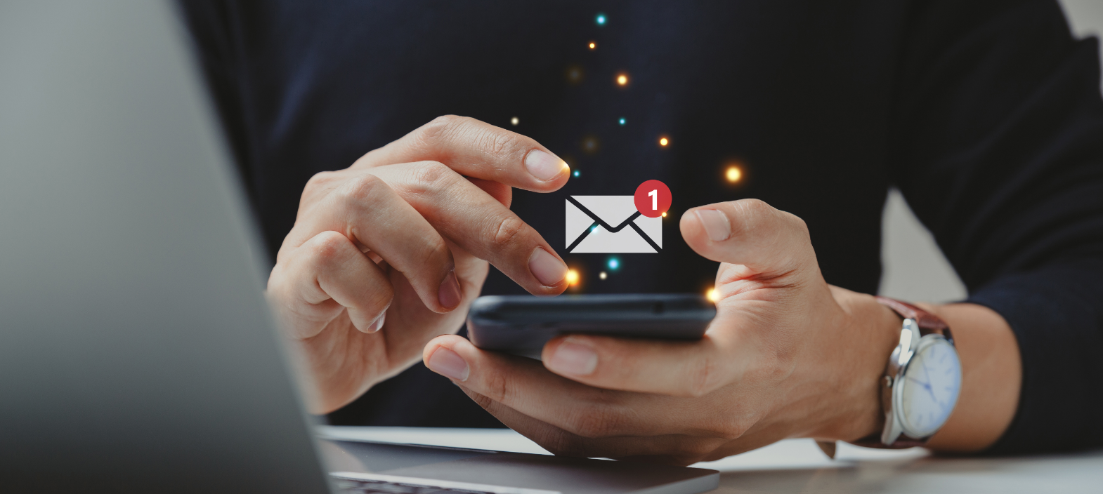 Person holding a smartphone with a new email notification, representing corporate holiday e-cards, digital holiday greetings and email marketing.